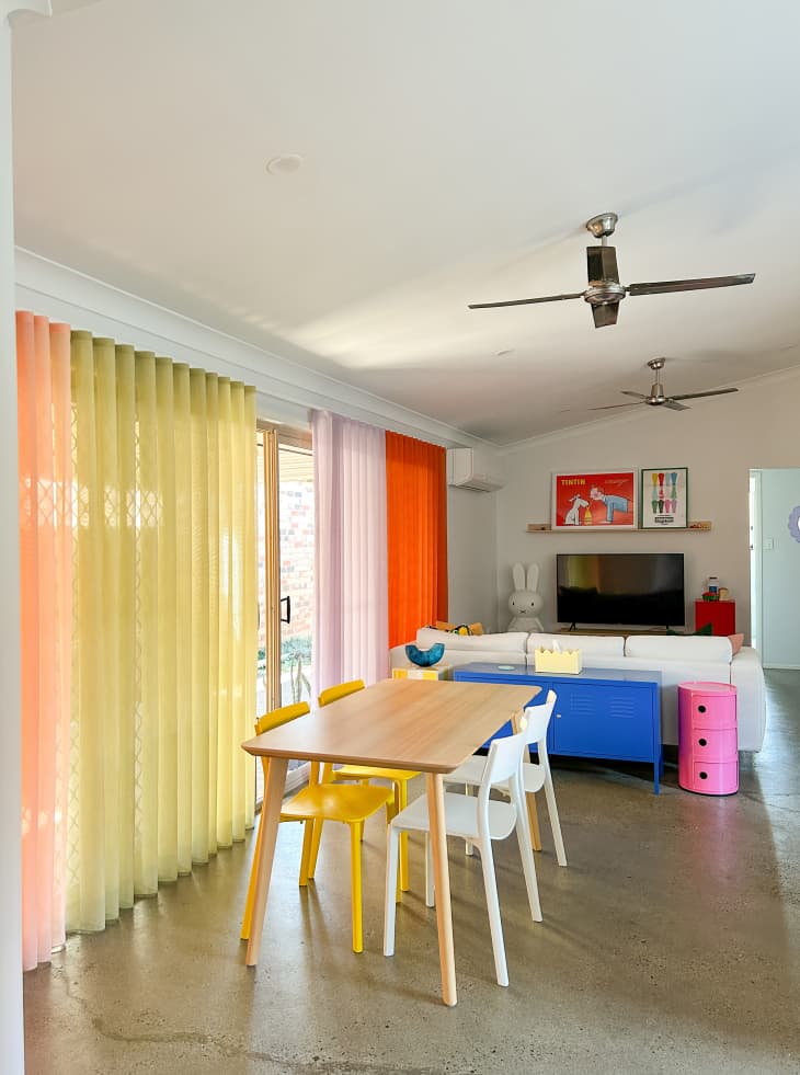 Colorful curtains on sliding doors in living space.