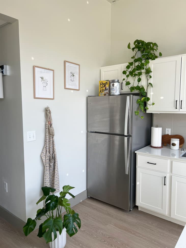 Stainless steel refrigerator in loft apartment.