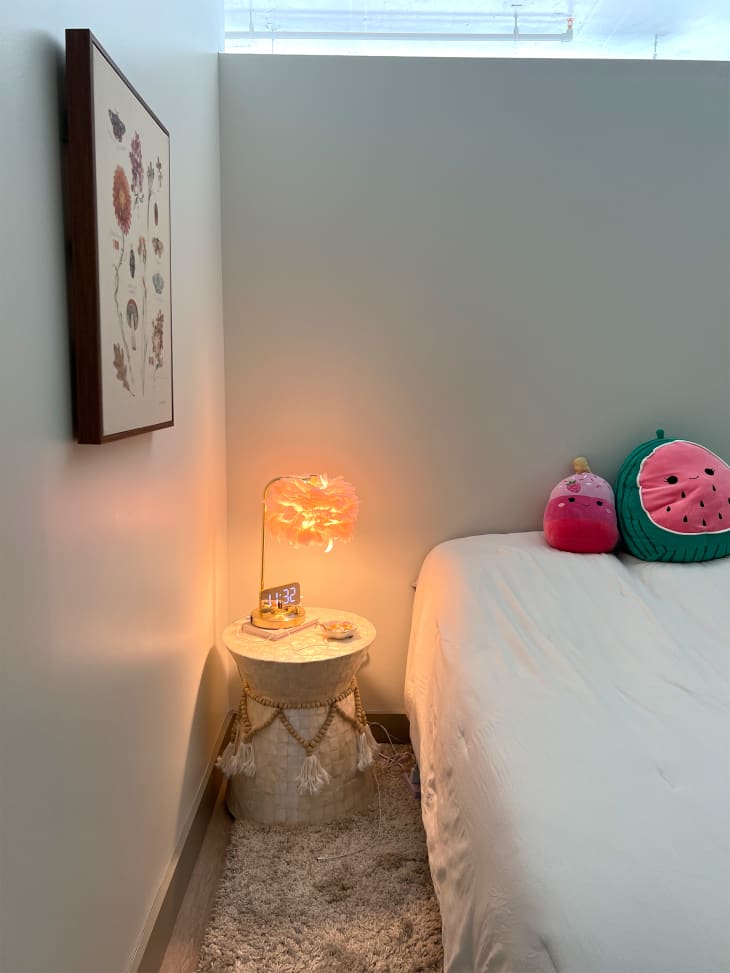 Lamp on side table in bedroom.