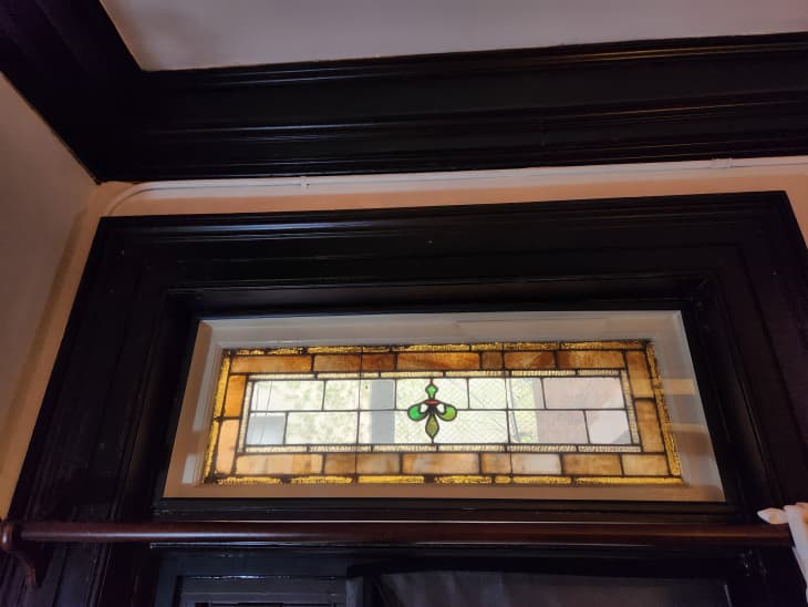 stained glass window detail with wood trim