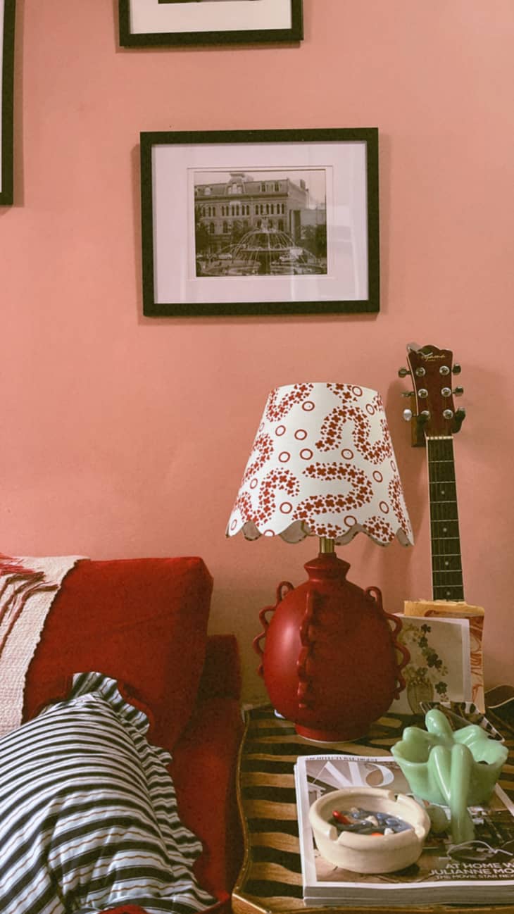 Colorful lamp in pink painted living room.