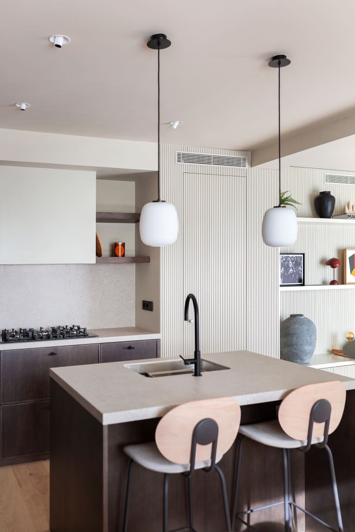 white modern minimalist kitchen with dark brown cabinets and island
