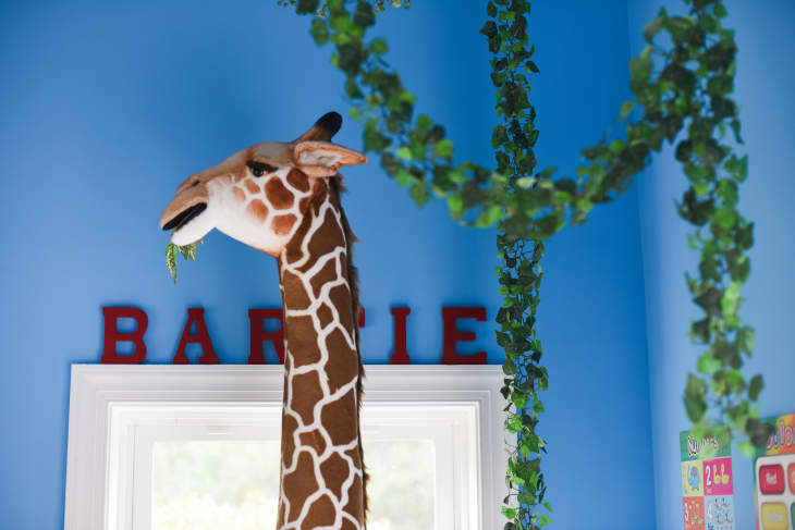 Toy giraffe in kids play room.