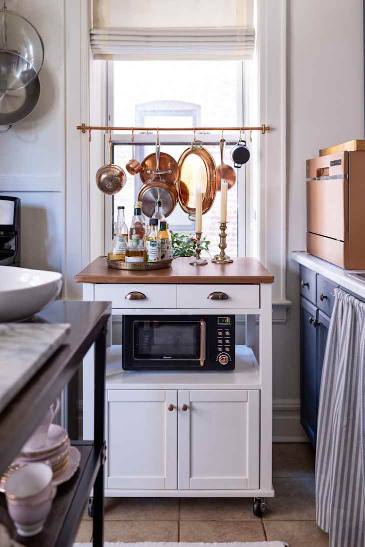 Hanging a Pot Rack in Front of a Window Is a Brilliant Idea | Apartment ...