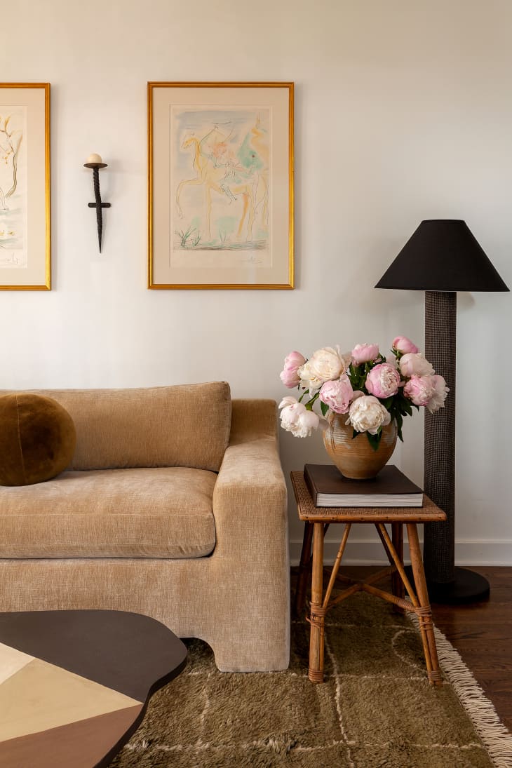 Peony arrangement on side table in neutral living room.