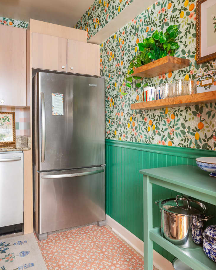 Green wainscoting in newly renovated colorful kitchen.