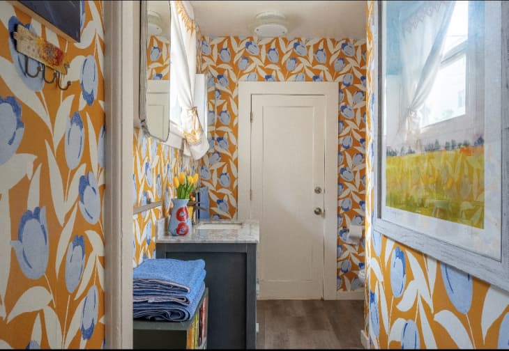 Hallway with orange blue and white tulip wallpaper