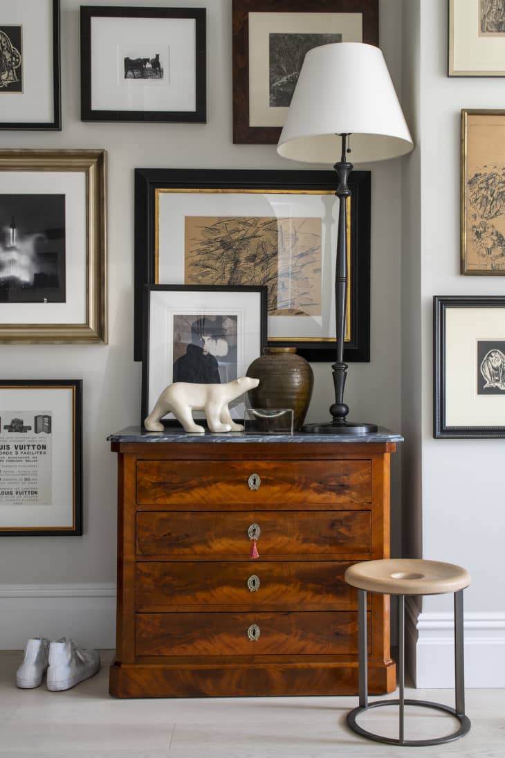 hallway area with gallery wall and vintage drawers