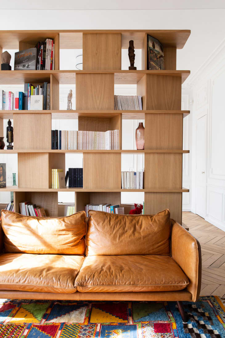 Large wooden bookshelf in living room.