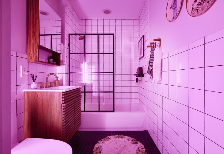 Pink light in bathroom.