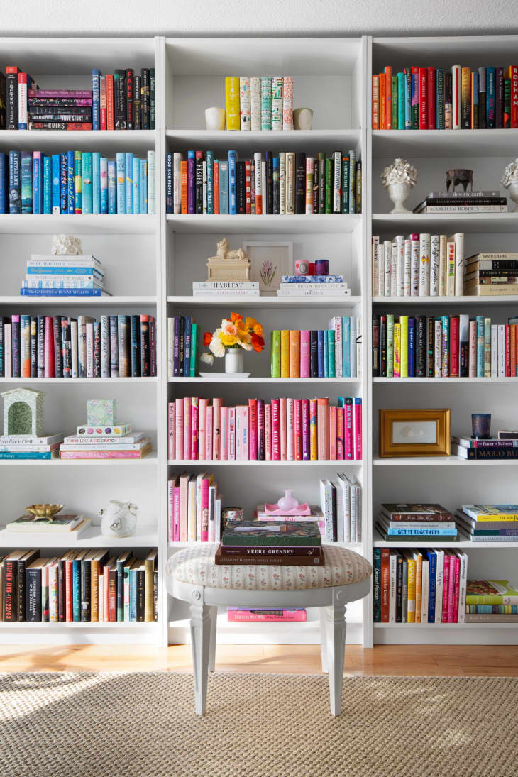Color coded floor to ceiling bookshelf