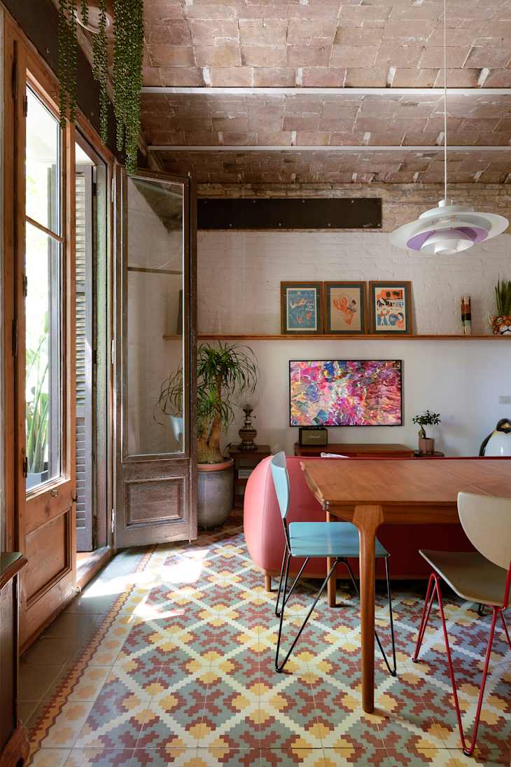 Graphic motif tile floors in historic Barcelona apartment.