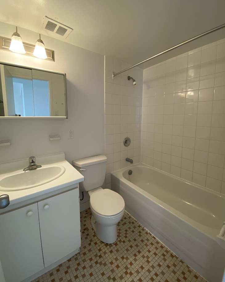 White bathroom with white and orange tiling