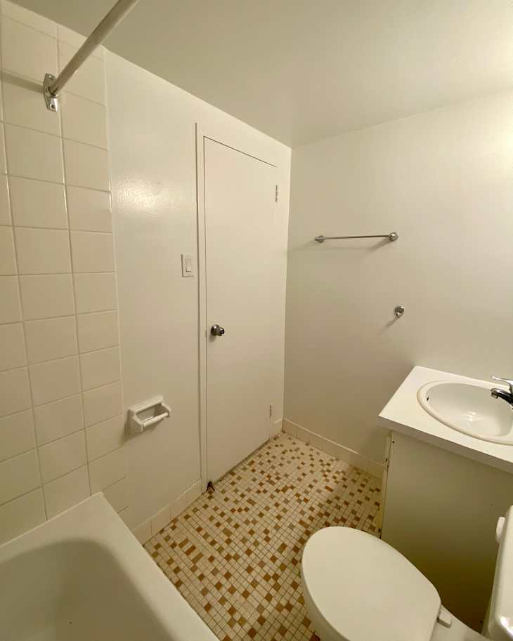 White bathroom with white and orange tiling