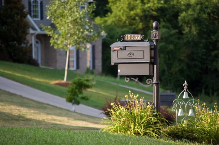 Front yard with mailbox and address number