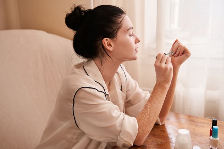 Woman painting own nails