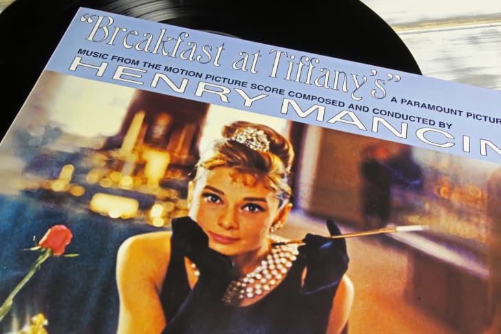 cover of music book for Breakfast at Tiffanys with Audrey Hepburn in black dress holding a cigarette
