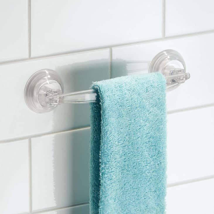 https://cdn.apartmenttherapy.info/image/upload/f_auto,q_auto:eco,w_730/at%2Fliving%2Frenter-bath-organizers-towel-bar