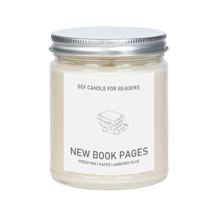 White candle that smells like new books