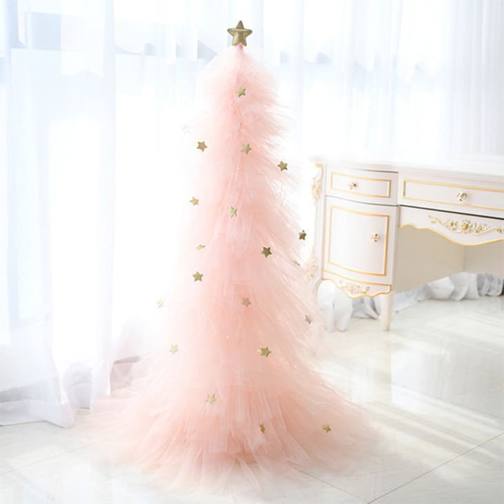 Light pink tulle tree with gold star decorations