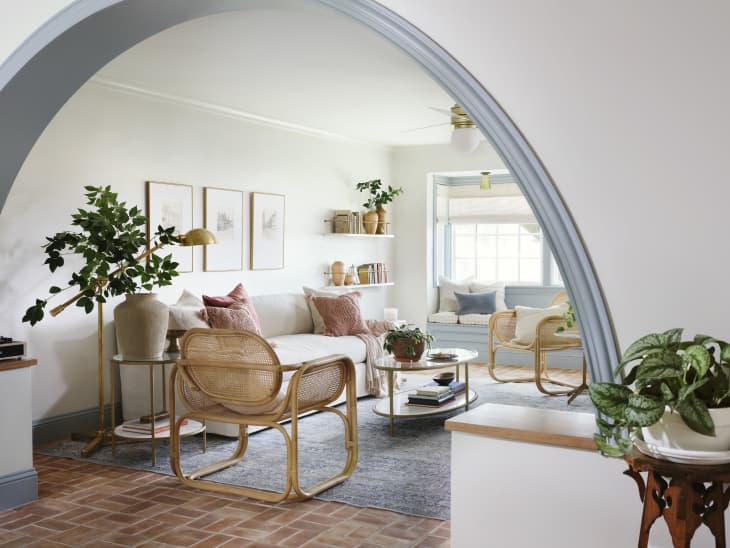 After: Bright, inviting living room with large arched entryway