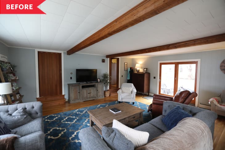 Before: Living room with blue accents and wooden beams across ceiling
