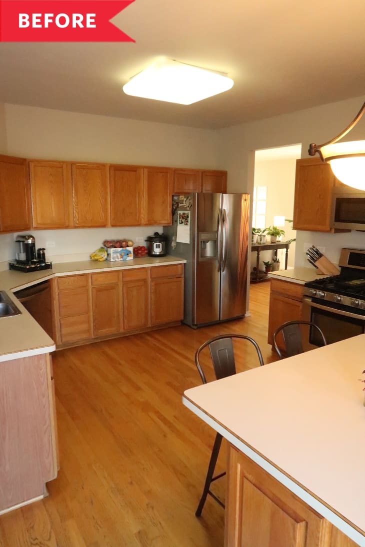 Before: kitchen with honey-colored wooden floors and cabinets