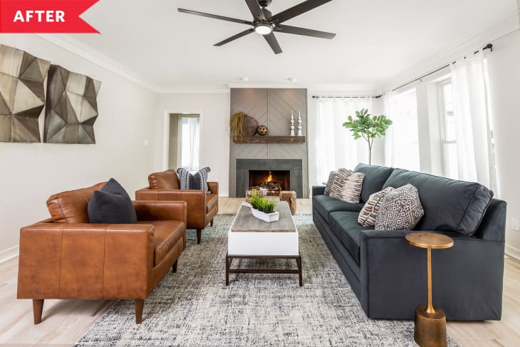After: Modern, airy living room with gray sofa, leather armchairs, and large fireplace