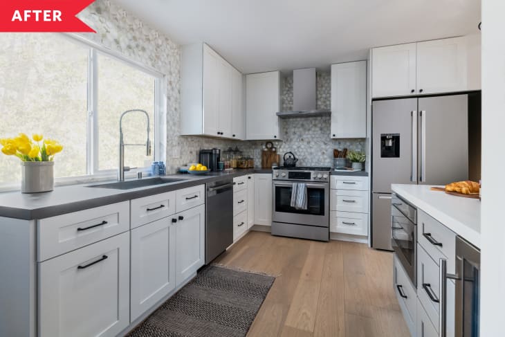 After: Bright kitchen with white cabinetry, stainless steel appliances, and honeycomb marble backsplash