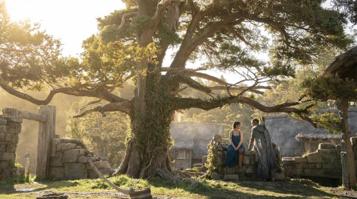 Still from Lord of the Rings Series showing two people sitting under a tree
