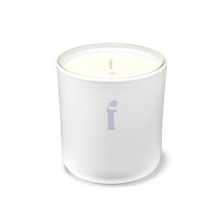 white candle with lavender 'f' on the jar