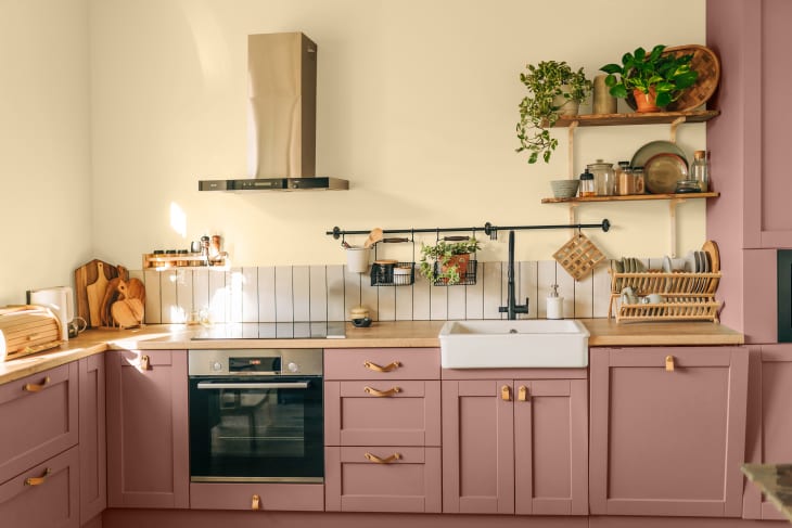 Kitchen with wall painted in Glidden's color of the year, Limitless (a pale honey beige)