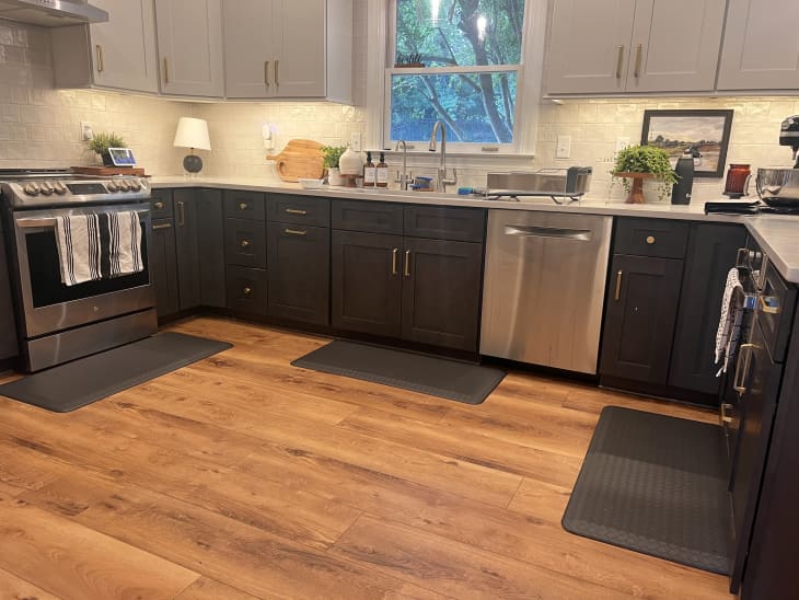 Kitchen with 3 mats on floor in different places