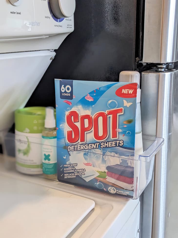 Spot detergent sheets on top of washing machine.