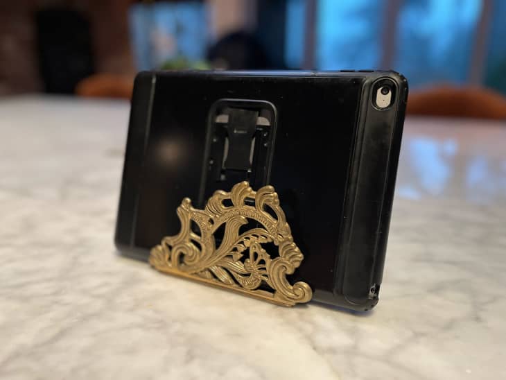 Phone in vintage napkin holder.