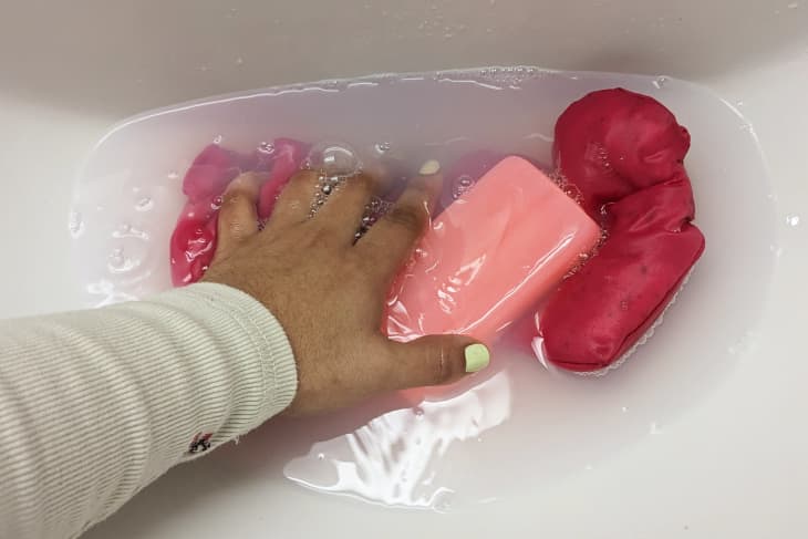 Soaking pinks clothes in sink
