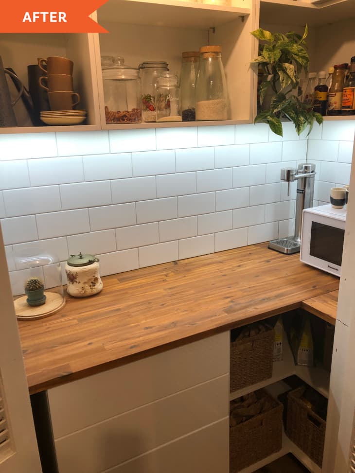 After: a wooden kitchen counter with organized white shelves above