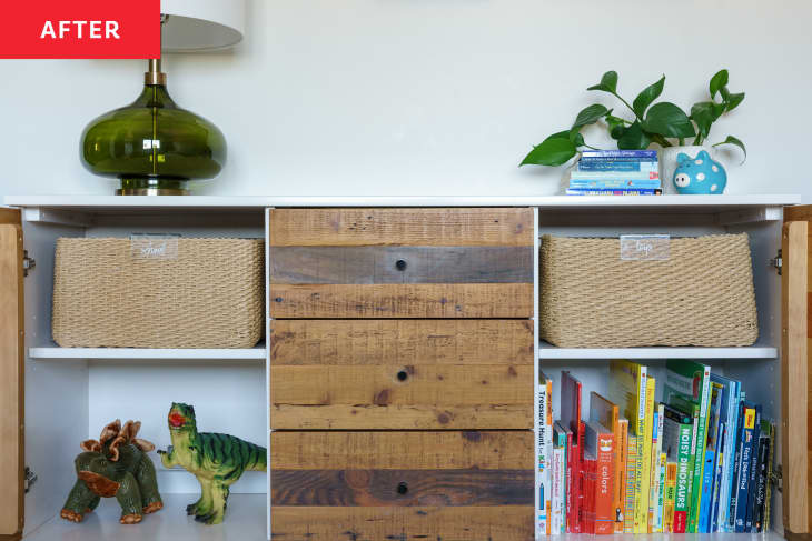 After: a low bookcase with toys and books