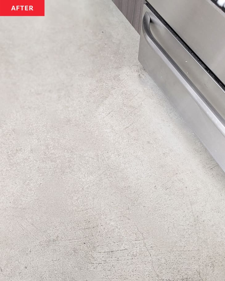 Cement kitchen floor after being cleaned with Oraimo Electric Spin Scrubber