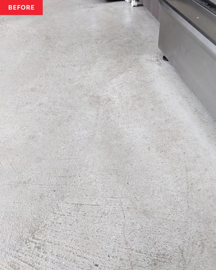 Cement kitchen floor before being cleaned with Oraimo Electric Spin Scrubber