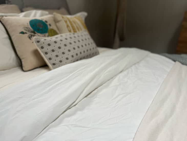 Wrinkled bedsheets before wrinkle free hack.