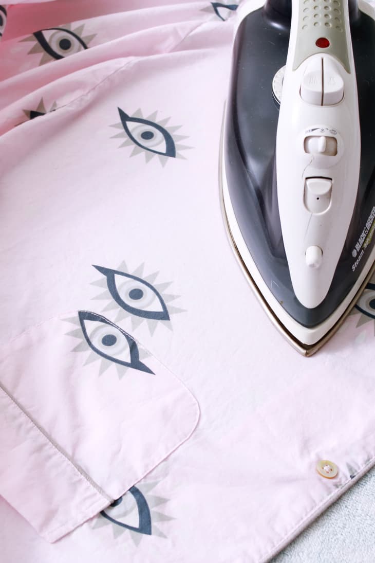 Ironing pink patterned pajamas