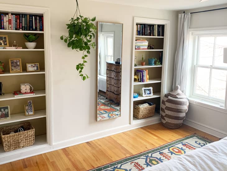 Built-in bookshelves in a sunny bedroom