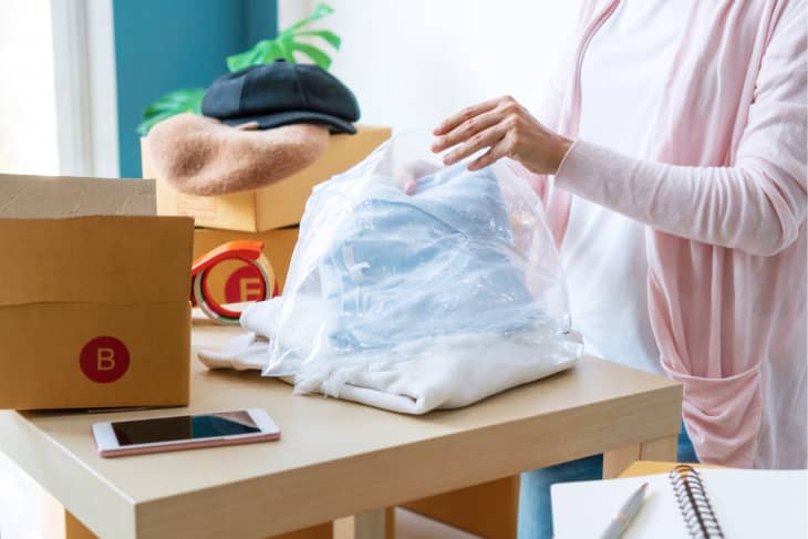 Freelance woman seller preparing product for packaging process.