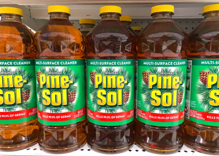 Grocery store shelf with bottles of original Pine Sol multi surface cleaner.