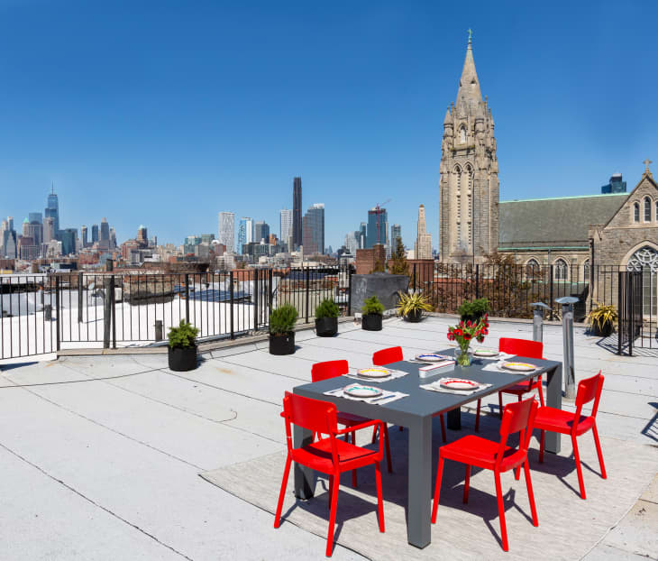 Outdoor dining furniture on Brooklyn rooftop deck.