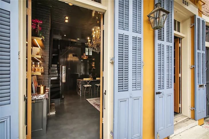 Doors open showcasing interior of New Orleans home.