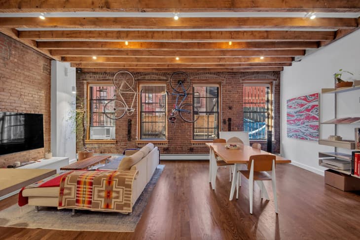 Brick walled in living space of NYC loft.