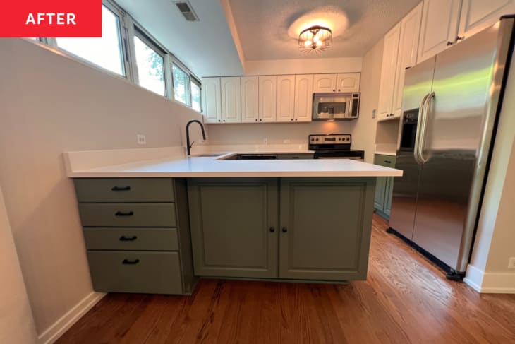 green bottom cabinets with white uppers and large plateau island with white counter tops