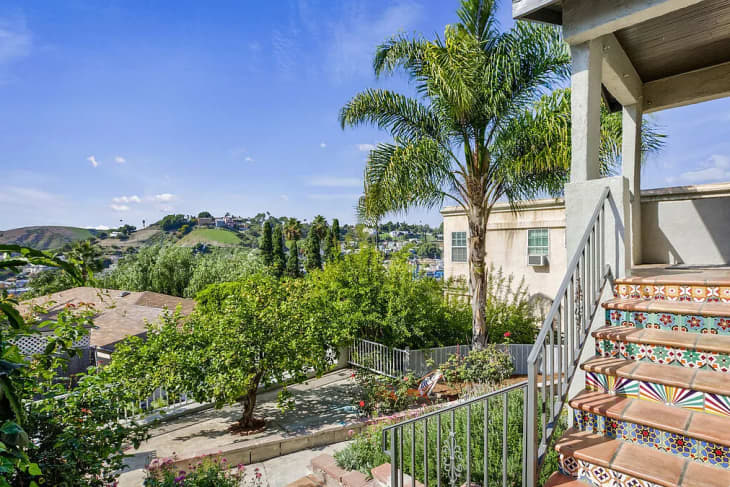 view of hills and tiled stairs from front porch of los angeles home